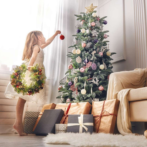 Young Girl Decorating the Christmas Tree
